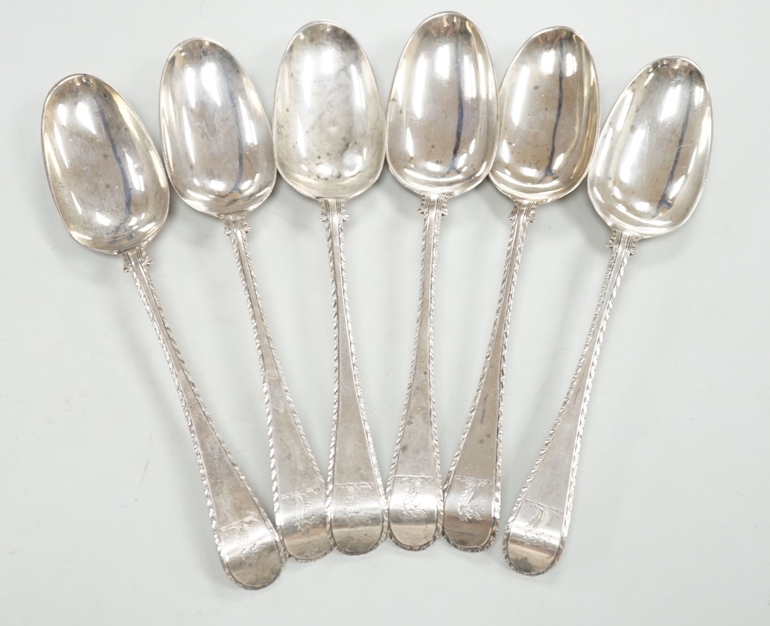 A set of six early George III silver Old English feather edge table spoons, Thompson Davis, London, 1764, 21.3cm, 12.6oz.